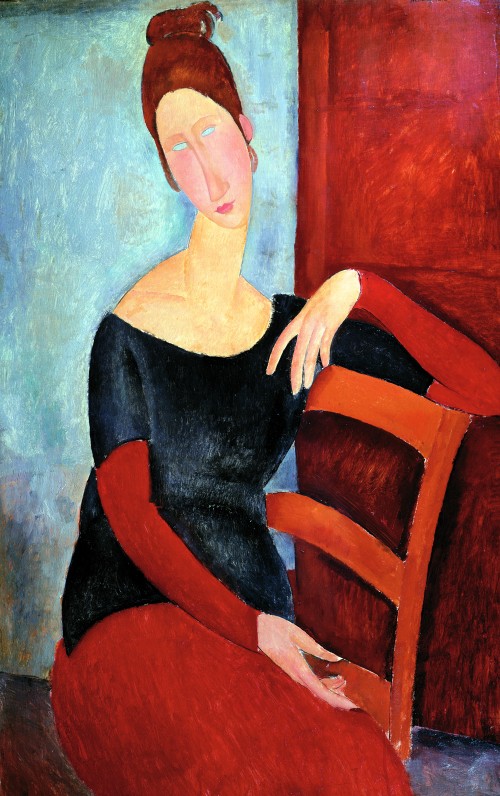 Jeanne Hébuterne seduta con il braccio sulla spalliera